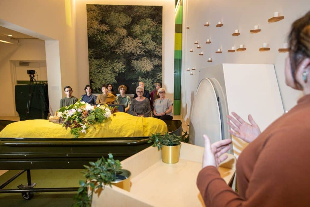 speaker talking to people at a funeral service in a funeral home