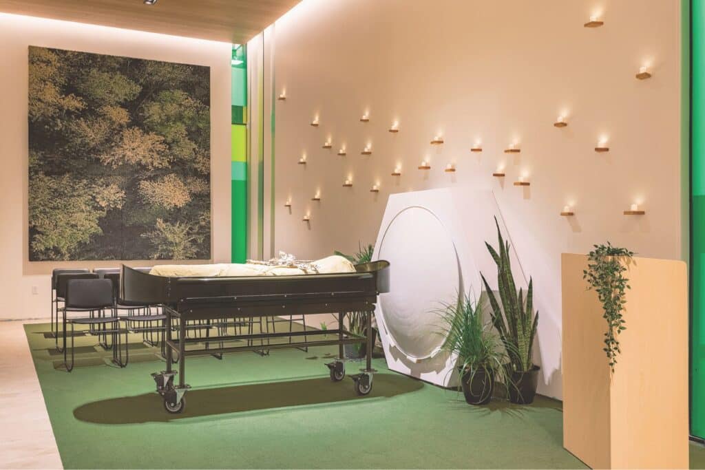 empty funeral service space with mannequin in center