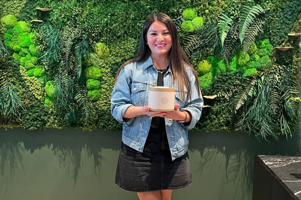 woman holding a soil container